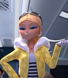 a woman in a yellow jacket and black and white striped shirt with her hands on her hips