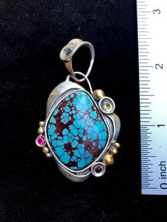 "Prince Turquoise gemstone pendant Hand-made Sterling Silver 925, 24k Gold Stones used: Prince Turquoise, Garnet, Peridot, Cubic Zirconia Height - 2 1/2\" (with bail), Width - 1 3/8\" Height -60mm (with bail), Width - 35mm Unique Handcrafted One-of a-kind Design Pendant Each Piece of Jewelry in my Collection is Absolutely One of a Kind! When you start wearing a piece of my jewelry you will fall in love with it more and more each day and feel that good Energy and Love that I pass into it while cr Bronze Pendant, Unique Gemstones, Good Energy, Agate Pendant, Metal Pendant, Turquoise Gemstone, Gemstone Colors, Gemstone Pendant, Gold Accents