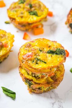 three frittatas stacked on top of each other with vegetables in the background