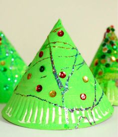 three green christmas trees made out of paper plates