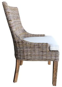 a wicker chair with a white cushion