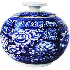 a blue and white vase with flowers painted on the outside, sitting in front of a white background