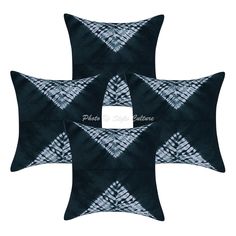 three black and white pillows with an abstract design on the front, one is square