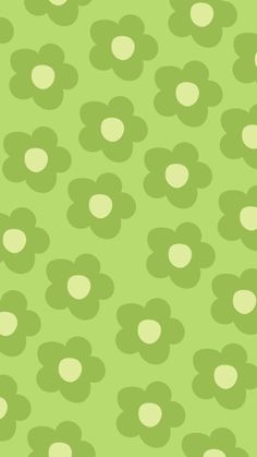 a green and white flower pattern with circles on it's center, as well as dots in the middle