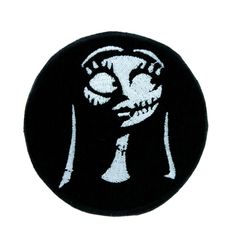 a black and white patch with a skeleton face on it