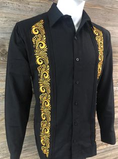 Authentic Mexican Guayabera.  Beautiful and Elegant Shirt  Handcrafted in Merida, Yucatan Mexico. Black Color Fabric - Cotton Polyester Blend Beautiful and Elegant Gold Embroidery - Palm Leaf Design Two Embroidery Panels Long Sleeve.  Good for Casual and Formal Wear, Wedding, Fiesta, Tropical, Birthday or any other occasion. 100% New Product - New Inventory 2024 We gladly accept returns and exchanges with these terms and conditions.  We do charge a 25% Fee on any returns. This helps compensate for shipping fees, packing supplies and labor costs.  Exchanges have no cost.  Customer is responsible for shipping items back.  We do not provide prepaid labels.  Items should be returned just as received and with no damages or signs of wear. Thank You Formal Festive Embroidered Shirt, Festive Formal Embroidered Shirt, Festive Black Embroidered Shirt, Traditional Embroidered Shirt For Formal Occasions, Festive Traditional Fitted Shirt, Elegant Fitted Shirt With Resham Embroidery, Traditional Long Sleeve Wedding Shirt, Traditional Festive Shirt For Formal Occasions, Traditional Festive Shirt With Floral Embroidery