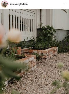 there is a brick garden bed in the front yard