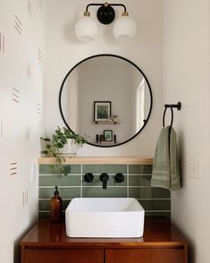 a bathroom sink with a mirror above it