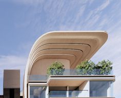 an architecturally designed building with trees growing on the roof and balconies above it