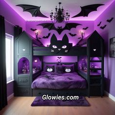 a bedroom decorated in purple and black with bats on the ceiling