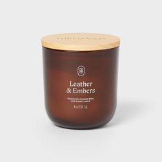 leather and embers candle with wooden lid