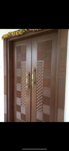 two wooden doors with decorative designs on them