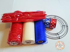 three rolls of red, white and blue thread