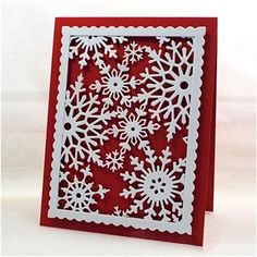 a red card with white snowflakes on it