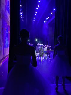 a group of people standing on top of a stage