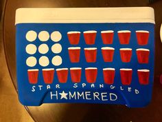 a cake shaped like a game board with red glasses on it and the words star spangled hammered