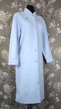 Vintage look light blue home dress / lounge tunic / bathrobe by EWM.  Measurements: Size: M Bust: 48 inch - 121 cm Sleeve: 23 inch - 58 cm Shoulder: 5 inch - 13 cm Shoulder to shoulder: 19 inch - 48 cm Length: 43 inch - 109 cm Please note that the things we're selling here are several decades old might show minor signs of wear even from being stored in warehouses for such a long time. However everything we sell is in fair good vintage condition or very close to that and if we spot any minor imperfections, we list them in description as precisely as possible.  We may miss some discrepancies due to human error but i do try my best to always thoroughly check items!  Please see all pics before making your choice. Long Sleeve Blue Nightgown For Home, Light Blue Long Sleeve Nightgown For Spring, Elegant Light Blue Sleepwear For Loungewear, Light Blue Long Sleeve Nightgown For Sleep, Light Blue Long Sleeve Nightgown, Blue Long Sleeve Nightgown For Lounging, Light Blue Long Sleeve Nightgown For Bedtime, Long Sleeve Blue Nightgown For Hospital, Blue Long Sleeve Hospital Nightgown