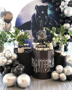 a batman themed birthday party with balloons and decorations