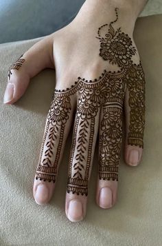 a henna tattoo on someone's hand