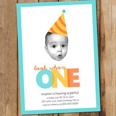 a birthday card with a photo of a baby wearing a party hat and the words look who's one on it