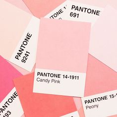 pantone's pink and white color swatches are arranged on top of each other