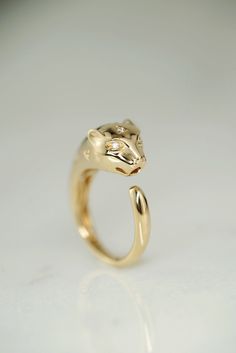 Our Third Eye Cheetah Ring is all about your inner power and intuition. She's made of solid 14k gold and natural diamonds and has triangle set diamond spots as well as diamond eyes. We love her little third eye diamond too.  Third Eye Cheetah makes a great statement pinky ring but also looks great on other fingers as well. Cheetah Jewelry, Panther Jewelry, Biker Jewelry, Inner Power, Diamond Eyes, Pinky Ring, Dream Jewelry, Third Eye, Rings Statement