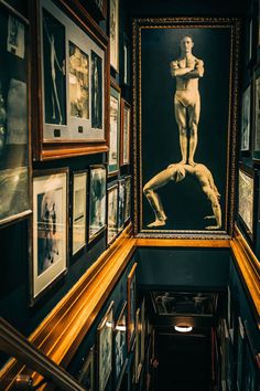 an art gallery filled with framed pictures and paintings