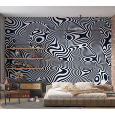 a bedroom with an artistic wallpaper design