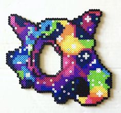 a cross stitch pattern of the letter d made out of different colored beads and sequins