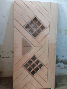 a wooden door with three different designs on the front and back doors, all made out of wood