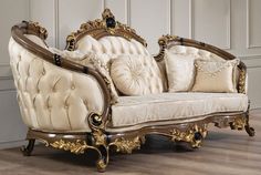 an ornately decorated couch sits on the floor