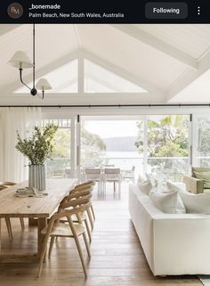 a living room filled with furniture and a wooden table