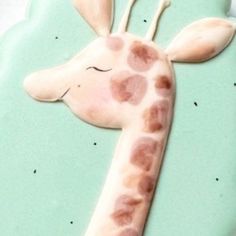 a giraffe cookie is decorated with frosting