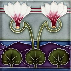 an artistic tile design with flowers and leaves