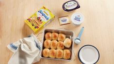 some food is sitting in a pan on a table next to other foods and utensils