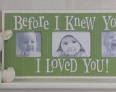 a stuffed animal sitting on top of a shelf next to a blue frame with two pictures