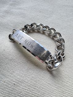 "An authentic vintage ID bracelet with the name Art Nowicki engraved. Speidel USA brand marking. curb link chain. all other bracelets shown in last image sold separately. era : 1950s-1980s material : aluminum or other silver tone metal color : natural patina condition : great with appropriate signs of age and wear approximate  measurements : length : 7.5\" width : 0.5\" - - - - - - - - - - - - - - - - - - - - - - - - - - - - - - - - - - - - - - - -  INTERNATIONAL SHIPPING AVAILABLE UPON REQUEST Craft Union does NOT accept returns or exchanges, all items are FINAL SALE Please consider the following prior to placing an order : Because measurements are provided, Craft Union does NOT grant refund/exchange requests if an item does not fit. We are always happy to assist interest buyers with any Medical Bracelet, Id Bracelets, Name Art, Chains For Men, Curb Chain, Us Army, Antique Items, Metal Color, Link Chain