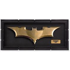 the dark knight batman logo is displayed in a shadow box