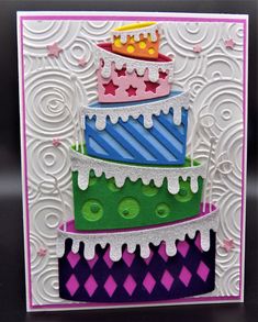 a handmade birthday card with three tiered cake