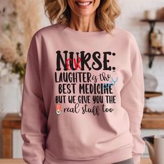 An ER nurse sweatshirt bound to be a favorite all year. A pre-shrunk, classic fit sweater that's made with air-jet spun yarn for a soft feel. Perfect for fall, nurse crews, Christmas gifts, and everyday comfort.  * 50% cotton, 50% polyester * Pre-shrunk * Classic fit * 1x1 athletic rib knit collar with spandex * Air-jet spun yarn with a soft feel * Double-needle stitched collar, shoulders, armholes, cuffs, and hem The design process is direct-to-garment, which uses quality ink that sinks into th Nursing Long Sleeve Relaxed Fit Sweatshirt, Long Sleeve Nursing Sweatshirt With Relaxed Fit, Fall Nursing Sweatshirt With Crew Neck, Fall Crew Neck Nursing Top, Emergency Nurse, Nursing Shirt, Emergency Nursing, Nurse Appreciation Gifts, Cute Nurse