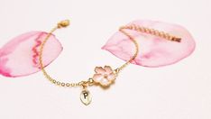 Super dainty Personalized Cherry blossom bracelet.▶▶ You can make this necklace personal choosing the quantity of letter leaf from option.Please leave a note for the desired letters in 'add your personalization'▶ Material - Gold plated over brass, Pearl▶ Chain Length - 5 ~ 9 inches (Please choose it from option)▶ charm measure - Flower H. 14mm x W. 13mm, Initial leaf ▶ The matching necklace availablehttps://www.etsy.com/listing/196300602/cherry-blossom-necklace-sakura-necklaceThe matching earrin Bridesmaid Bracelet Flower, Cherry Blossom Bracelet, Cherry Blossom Necklace, Blossom Bracelet, Karma Necklace, Bracelet Flower, Geometric Bracelet, Daisy Necklace, Pearl Pink