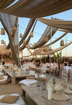 an outdoor dining area with tables and chairs