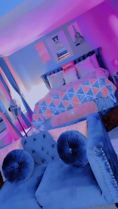 a bedroom with blue and pink furniture in it