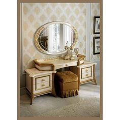 a dressing table with a mirror and stool