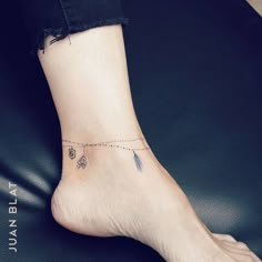 a person with a tiny tattoo on their foot