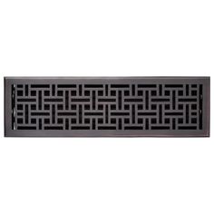 an ornate design on the side of a wall mounted heat grate in dark wood