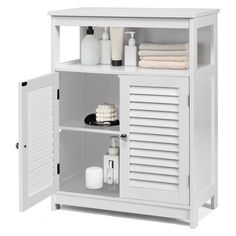 a white cabinet with shutter doors and shelves on the front, open to show bathroom items