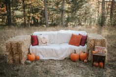 a couch made out of hay and pumpkins