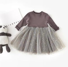 Dress your little princess up in our stylish sparkle long sleeve tutu dress in gray, gold and silver. Featuring a knit bodice which is attached to a sparkle tutu skirting. Perfect for photos, birthdays or everyday dress up. Also available in vintage pink. SHIPPING Ready to ship in 10-15 business days. Tule Rok, Bright Dress, Girl Sleeves, Winter Girls, Korean Dress, Star Dress, Toddler Girl Dresses, Tutu Dress