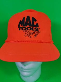 an orange hat with the word mad tools on it's front and back side